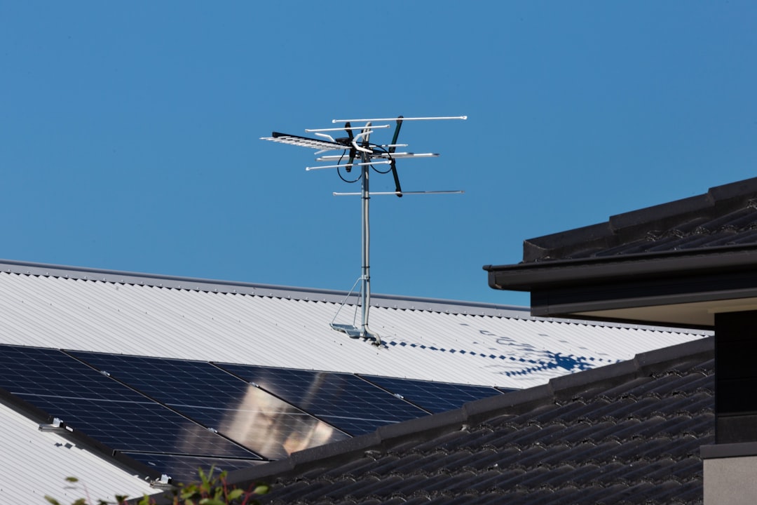 service-01 Rooftop solar panels with TV antenna.