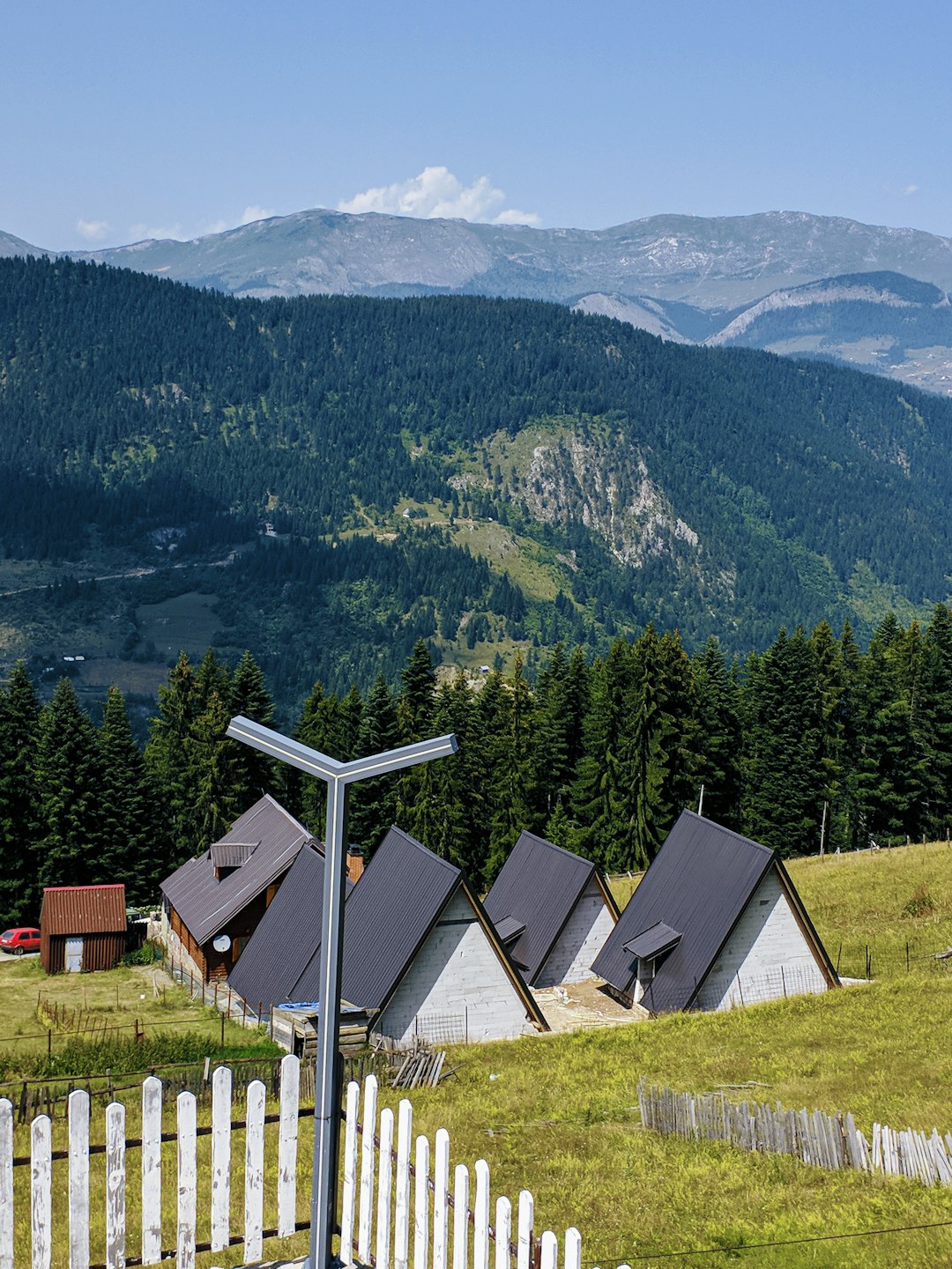 service-06 white-and-brown-house-on-green-grass-field-near-green-mountains-during-daytime-eey5ma7nwye